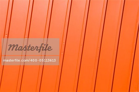 Corrugated metal panel painted in vivid orange.