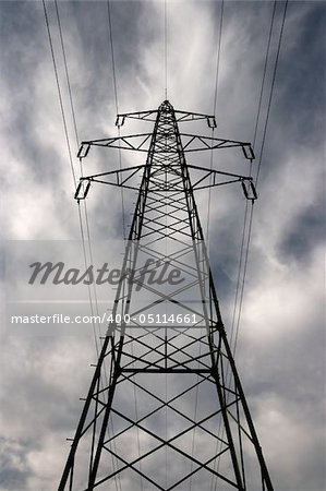 Electric pillar against dramatic sky