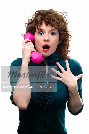 Young woman holding handset. Isolated on white