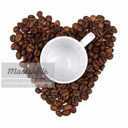 coffee bean heart made background with cup in the middle. isolated on white background. landscape orientation.