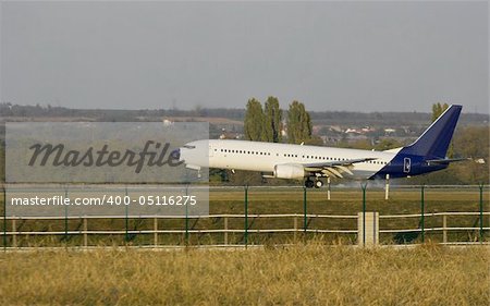 Plane touching ground on the runway