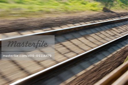Railway track blurred by high speed motion