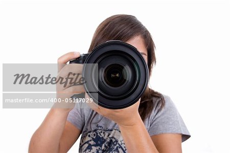 young female photographer with digital slr isolated on white background