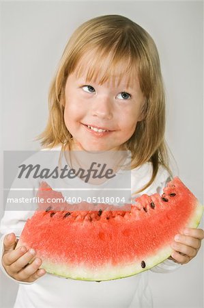 Picture of young girl and a slice of watermelon