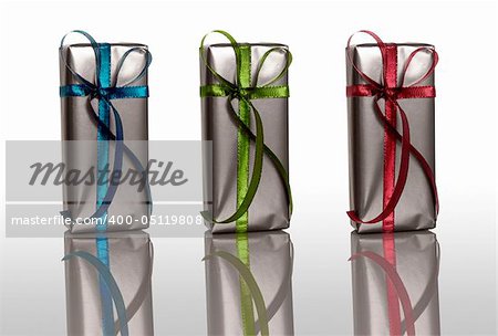 Beautiful colored Christmas boxes isolated on white with reflection