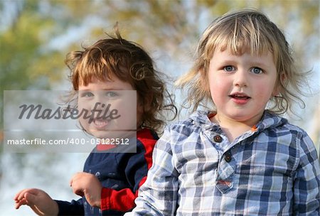 Two happy brothers having fun outdoors