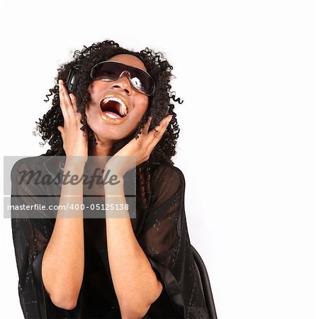 Black Woman Singing While Listening to Music on Headphones