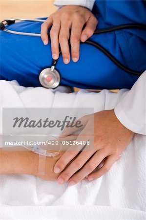 doctor comforting patient who is with i.v drips