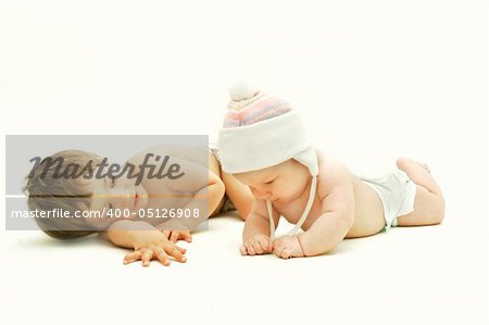 brother and sister looking at each other over white