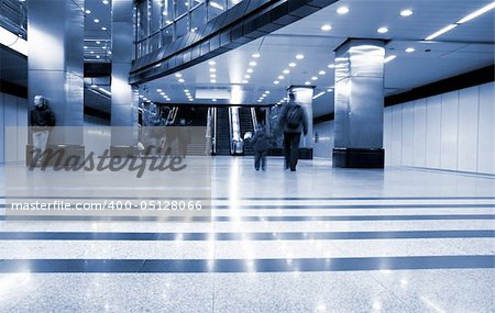 Subway station with train in motion. Motion blur. Blue tint