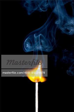 match burning with fire and smoke isolated on black background