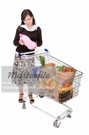 attractive brunette woman with shopping cart. over white background