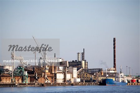 An industrial shipping dock on the sea