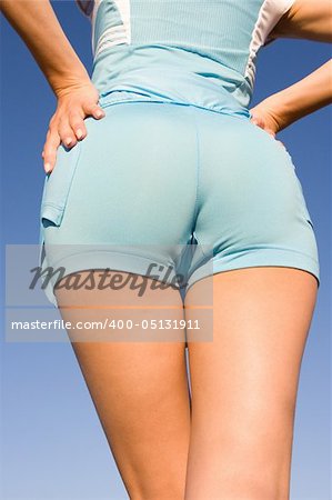 Nice buttocks on the blue sky background
