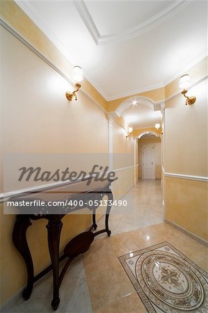Beautiful table in a light corridor with a door