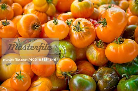 A Pile of Different Varieties of Heirloom Tomatoes