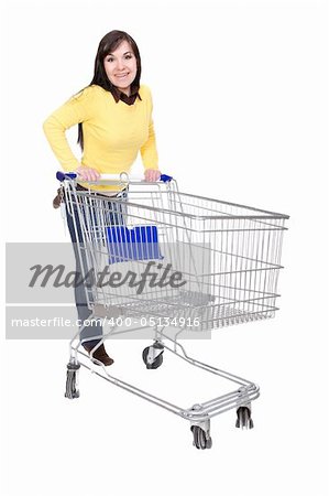 brunette woman with shopping cart. over white background