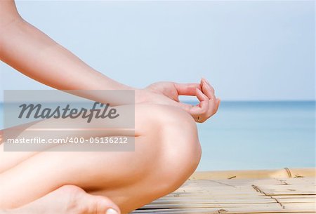 Fragment like view of woman  practicing yoga in summer environment