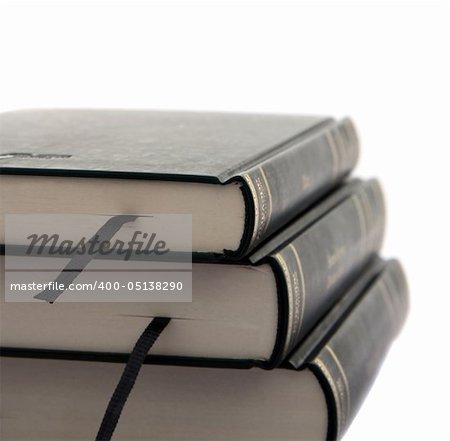 Stack of three books isolated on white background