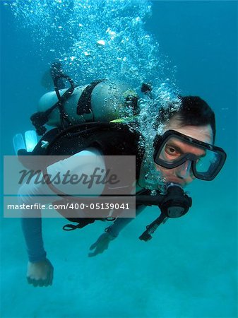 Man Scuba Diving in Great Barrier Reef