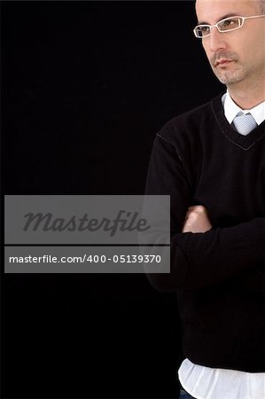 Businessman standing with arms folded