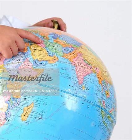 Kid studying the globe.