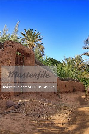 old gate in a clay fence in Morocco