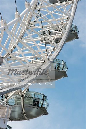 Detail of the London Eye against blue sky