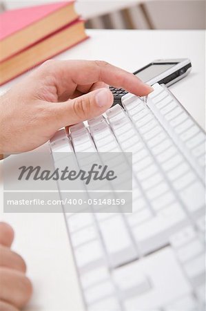 Hands, keyboard and hands on desktop