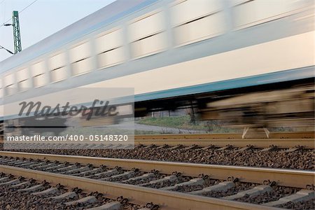 Passenger train passing by with motion blur