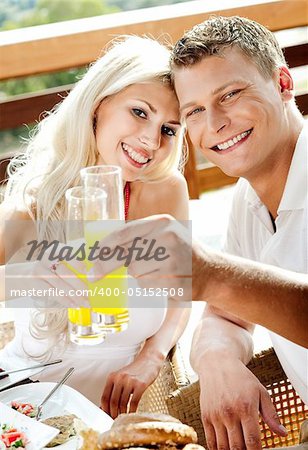 man and woman having breakfast