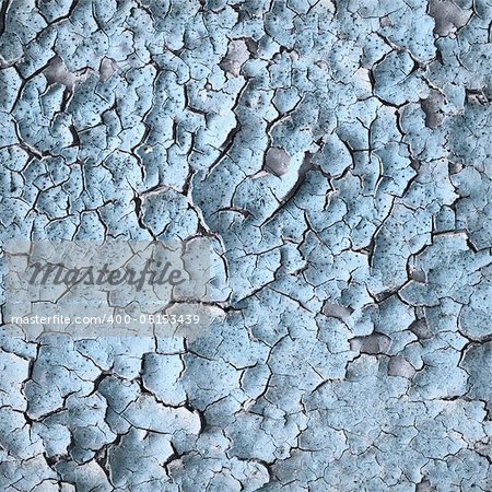 Surface of an old blue wall with cracks