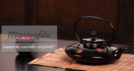 Traditional Chinese tea ceremony with kettle and cup