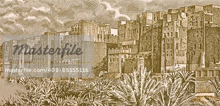 Shibam City on 50 Rials 1993 Banknote from Yemen. The houses of Shibam are all made of mud bricks and about 500 of them are tower houses that rise 5 to 16 stories high while each floor has one or two apartments.