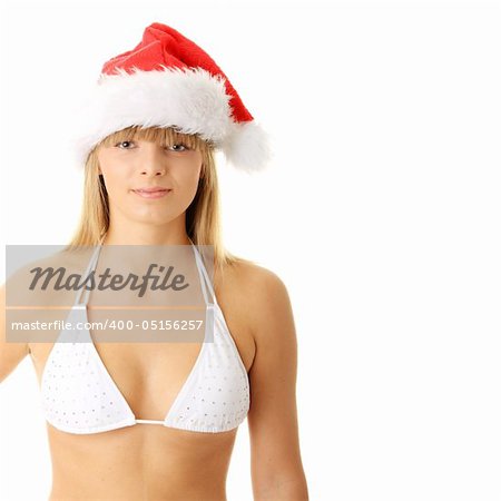 Sensual young woman wearing christmas hat. Isolated