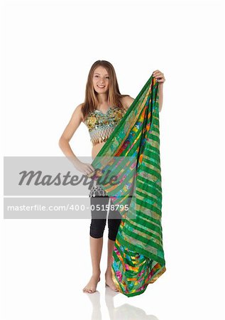 Young Caucasian belly dancing girl in beautiful decorated clothes on white background and reflective floor. Not isolated