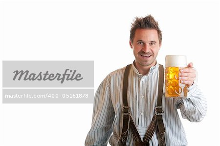 Bavarian Man dressed with traditional leather trousers (lederhose) holding Oktoberfest Beer Stein (Mass)