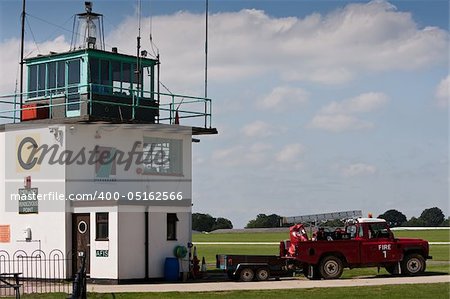 Control tower with land rover fire truck parked at the ready