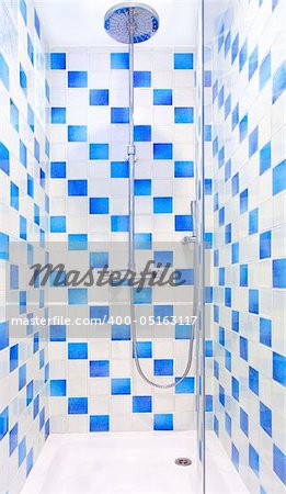 Interior of shower with blue and white tiles