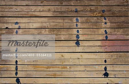 Plank background of old dirty weathered wood with spots of paint