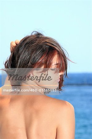 woman relaxing in the afternoon by the sea in Greece