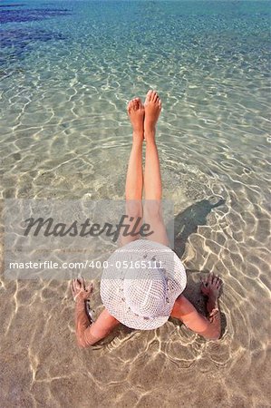 woman relaxing in the afternoon by the sea