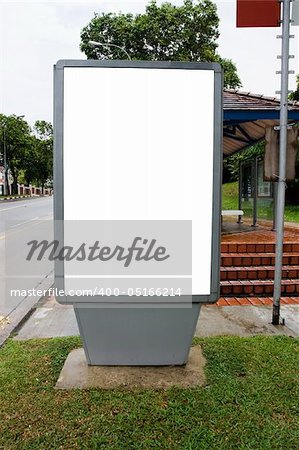 Blank billboard display at bus stop with clipping path for your advertising