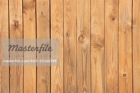 Surface of a wall covered with pine wooden boards