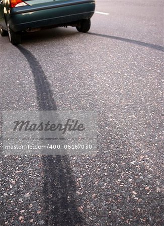 Tire print on asphalt road