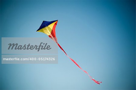 Flying kite in the blue sky