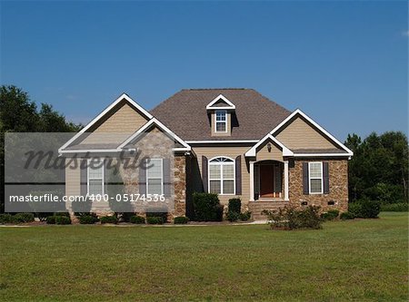 Single story stone and vinyl residential home.