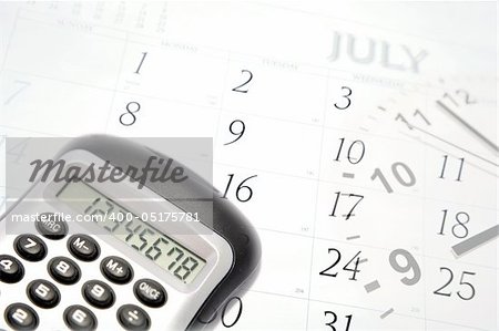 Calculator, clock hands and July calendar