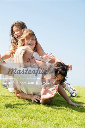 Family having fun on meadow