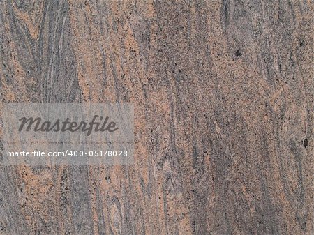 Marbled grained texture with a vertical grain in gray and tan colors.